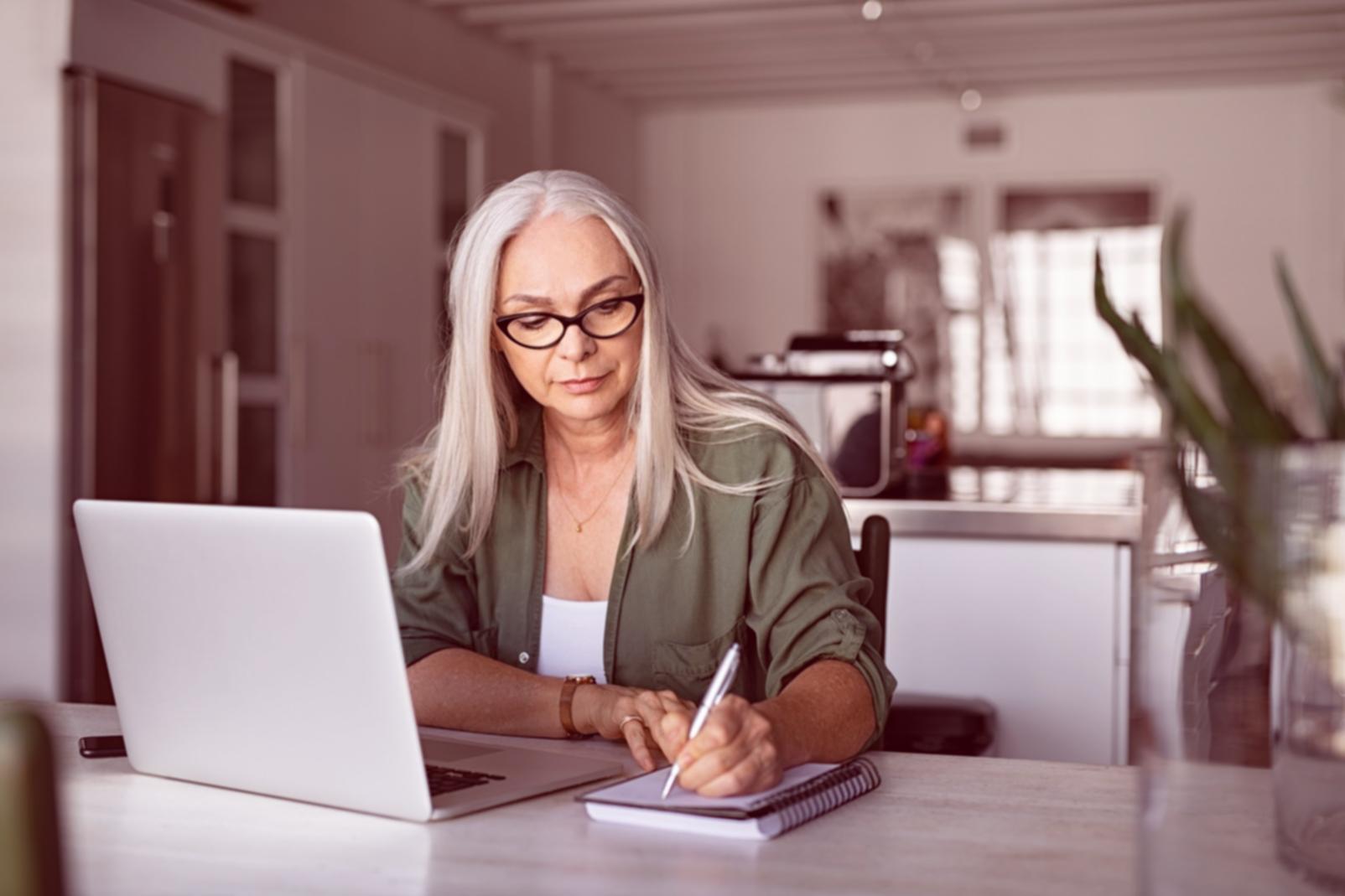 Financial professionals reviewing business communication materials in modern office setting